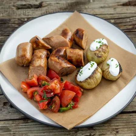 Bratwurst with Baked Potatoes and Tomato Salad