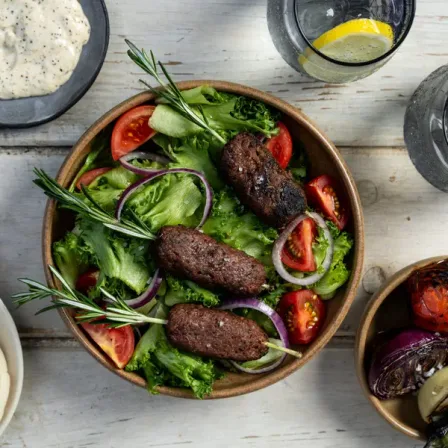 Lamb Kofta on Rosemary Sprig Skewers alongside fresh salad